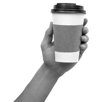 Coffee cup held by a hand against a white background during a daytime activit Stock Photos