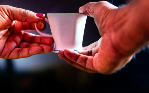 Coffee cup with human hands Stock Photos