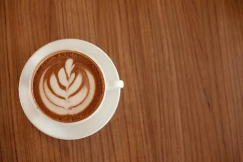 Coffee cup on kitchen table. Top view with copyspace Foto stock