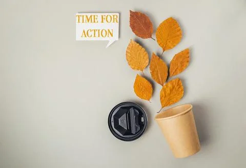 Coffee cup with a leaf on it and the words Time for Action written on it Stock Illustration