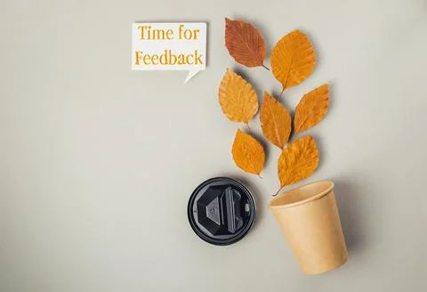 Coffee cup with a leaf on it Stock Photos