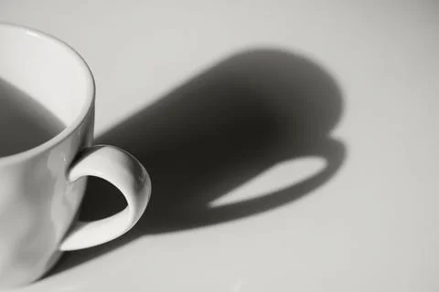Coffee cup with long shadow side view color of 2026 year cloud white Stock Photos