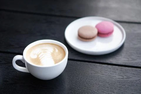 Coffee cup with macaroons Stock Photos