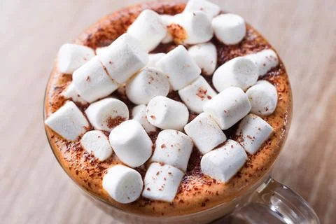 Coffee cup with marshmallows Stock Photos