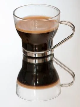 Coffee cup on a mirror Stock Photos