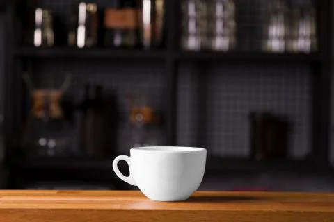 Coffee cup mock up template for logo design display at the bar counter Stock Photos