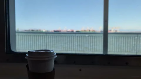 Coffee cup on a moving ferry crossing the sea, establisher Stock Footage 341570707
