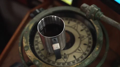 Coffee Cup on Old Compass, Shallow Depth of Field Fishing Boat Denmark Stock Footage 315999816