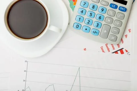  Coffee cup over financial documents Coffee cup over financial documents ,... Foto stock