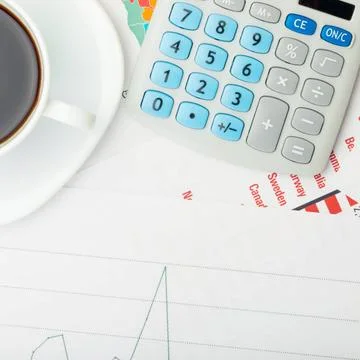  Coffee cup over financial documents Coffee cup over financial documents ,... 写真素材