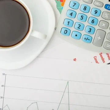 Coffee cup over financial documents Coffee cup over financial documents Co... 写真素材