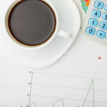 Coffee cup over financial documents Coffee cup over financial documents Co... 写真素材