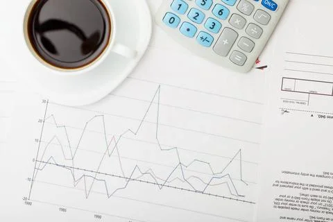  Coffee cup over some financial documents - view from top Coffee cup over ... Stockfoto's
