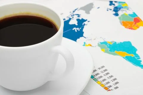 Coffee cup over world map - business concept Fotos de archivo