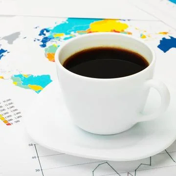 Coffee cup over world map and some financial documents Coffee cup over wor... 写真素材