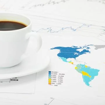 Coffee cup over world map and financial documents Coffee cup over world ma... 스톡 사진