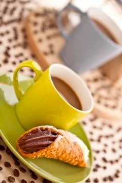 Coffee cup with pastry Stock Photos