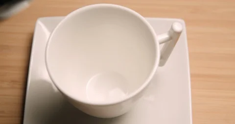 Coffee cup pouring close up 4K Stock Footage 127403199