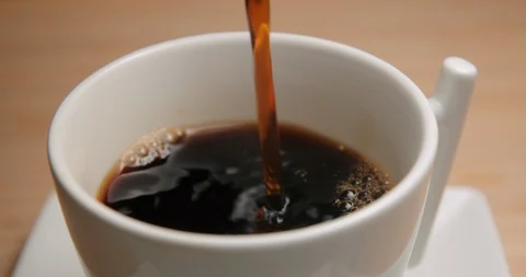 Coffee cup pouring close up 4K Stock Footage 127403494