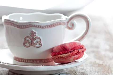 Coffee cup with raspberry macaron Stock Photos