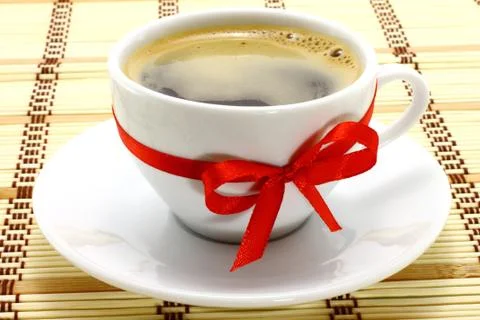 Coffee cup red bow Stock Photos