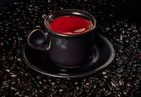 Coffee cup with red reflection Stock Photos