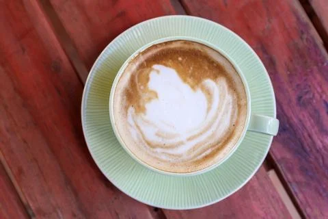 Coffee cup on red table Stock Photos