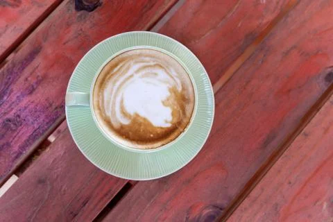 Coffee cup on red table Stock Photos