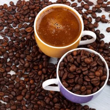 Coffee cup with roasted beans Stock Photos