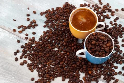 Coffee cup with roasted beans Stock Photos