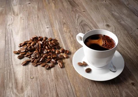 Coffee cup with roasted beans on rustic table Stock Illustration