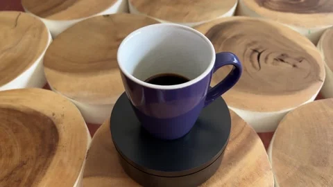 Coffee cup rotating on turntable Stock Footage 333597112