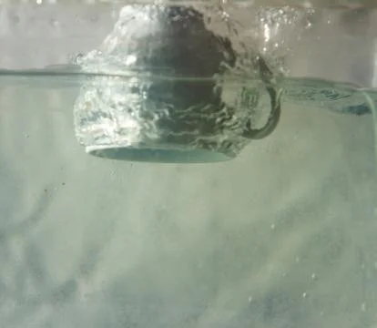 Coffee cup splash Stock Photos