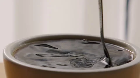 Coffee in a cup with spoon. of a cup hot black home making coffee. Stock-Footage 254943689