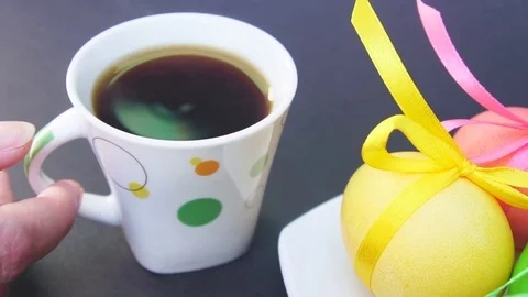 Coffee Cup With Steam and the Easter Eggs Stock Footage 73615863