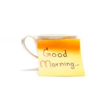 Coffee cup with sticky note write Good morning Stock Photos