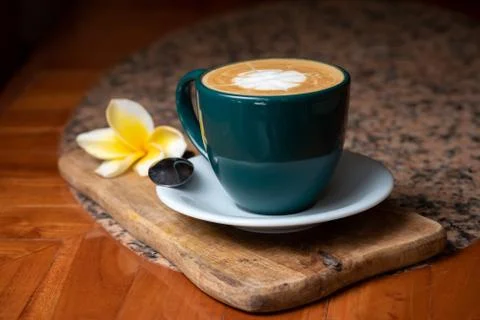 Coffee cup on stone kitchen table. Cappuccino, hot latte or coffee with milk. Stock Photos
