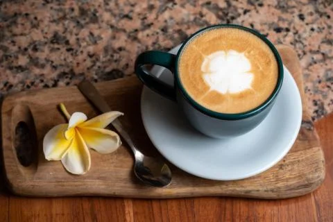 Coffee cup on stone kitchen table. Cappuccino, hot latte or coffee with milk. Stock Photos
