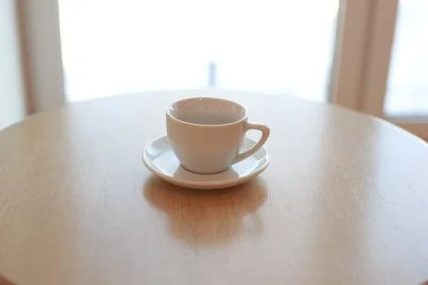 Coffee Cup is on the table in a cafe with a blurry background Stock Photos