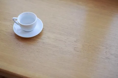 Coffee Cup is on the table in a cafe with a blurry background Stock Photos