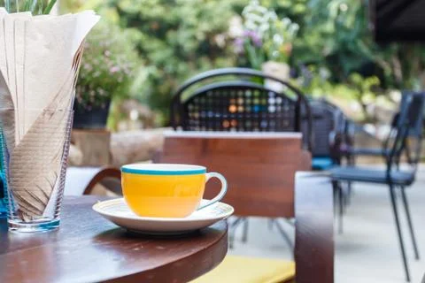 Coffee cup on table in cafe Stock Photos