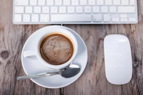 Coffee Cup on the Table with Computer Keyboard for Business Concept Stock Photos