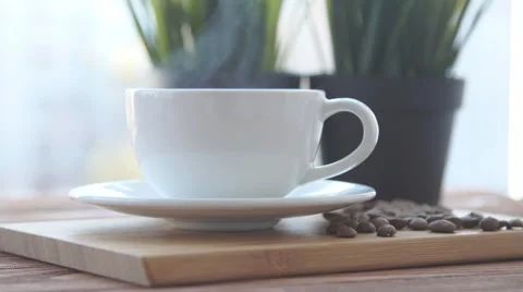 Coffee cup is on the table Stock Footage 68969677