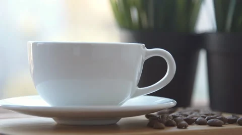 Coffee cup is on the table Stock Footage 68969953