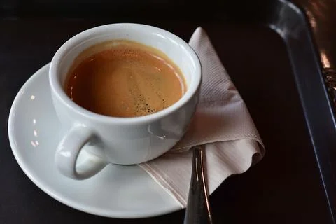 The coffee cup is on the table. It's hot. Stock Photos