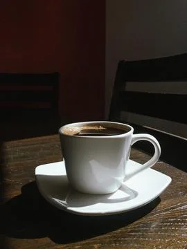 Coffee cup on the table Stock Photos