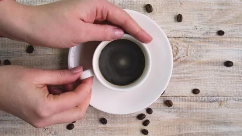 Coffee in a cup on the table. selective focus. Stock Footage 147948906