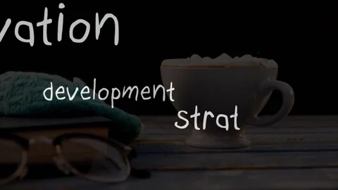 Coffee cup on table showing animation with words development and strategy Video stock 306170388