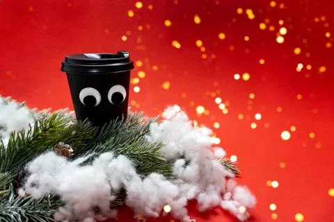 Coffee cup with tree and snow Stock Photos