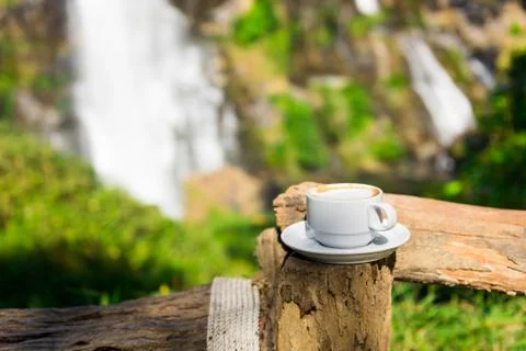 Coffee cup with waterfall background Stock-Fotos